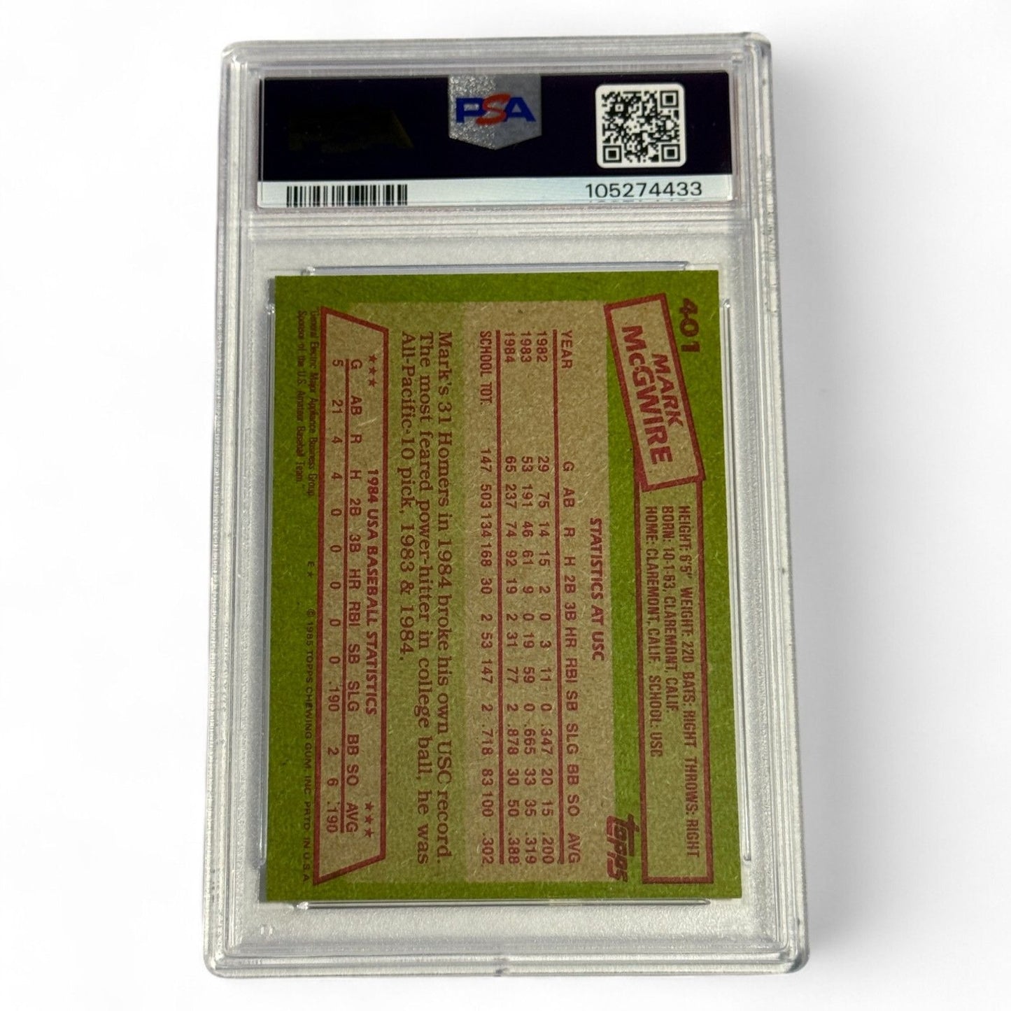 A PSA 7 near‑mint 1985 Topps #401 Mark McGwire rookie card featuring him in the 1984 USA Baseball Team uniform, an iconic Olympic‑era collectible.