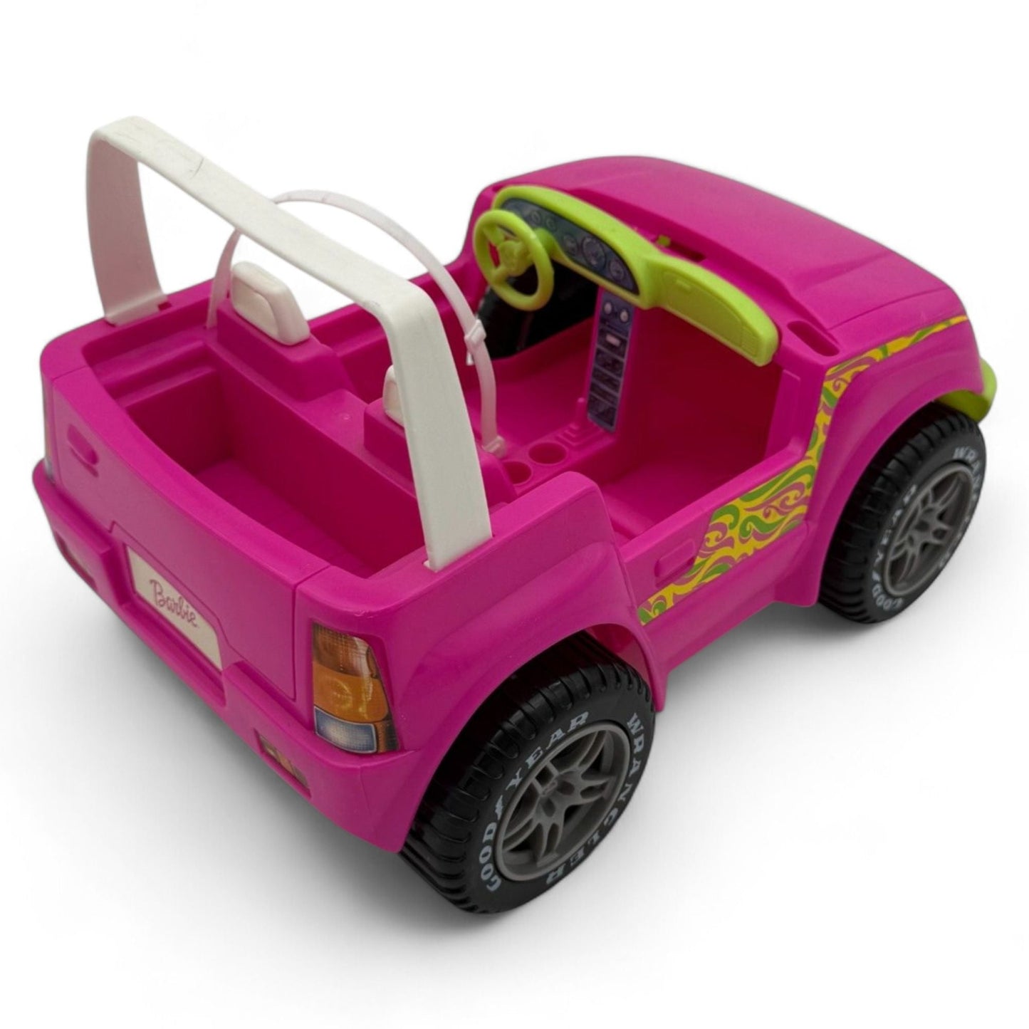 Side view of Barbie Jeep Wrangler Convertible with vibrant colors and tire details