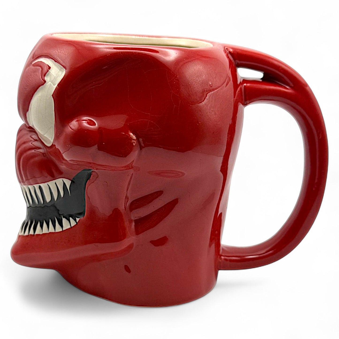 Angle view of Carnage mug showing villainous face and curved sculpted features