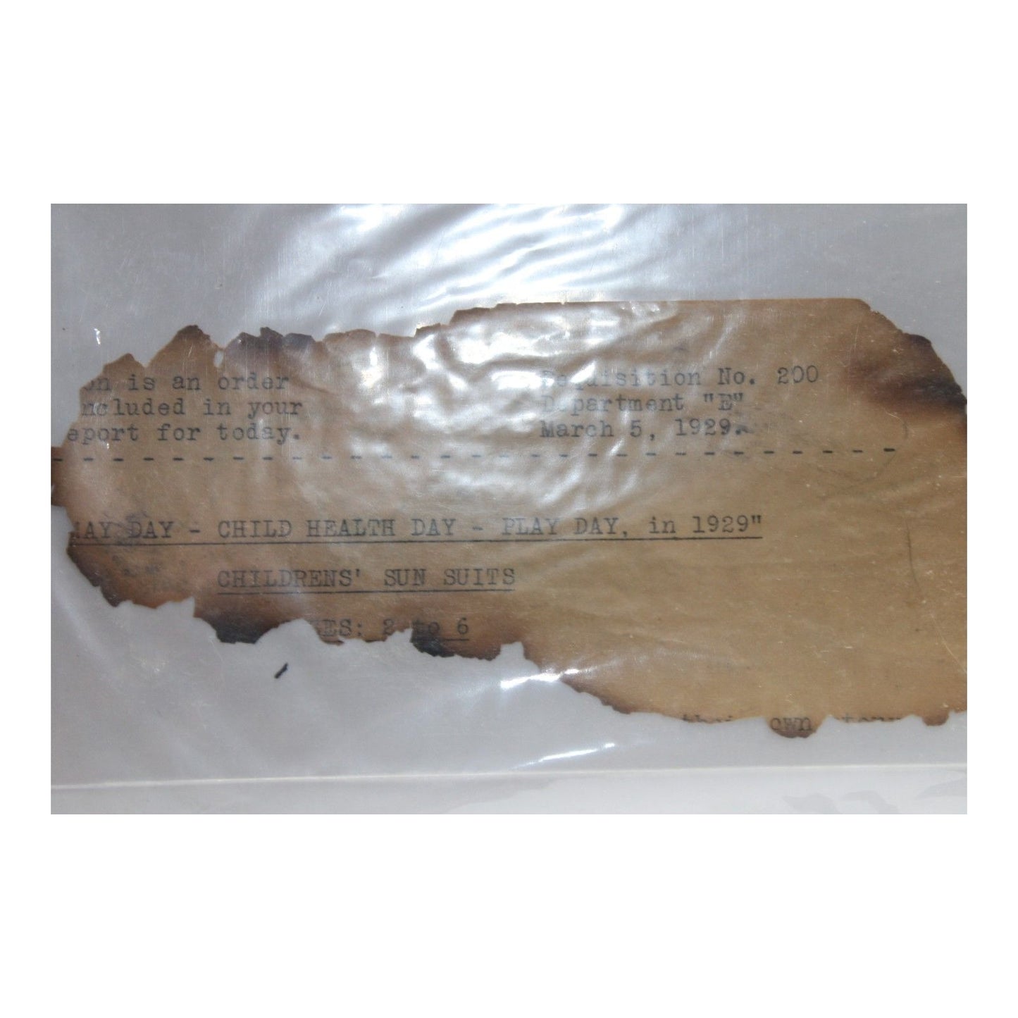 Burnt paper with text on a white background