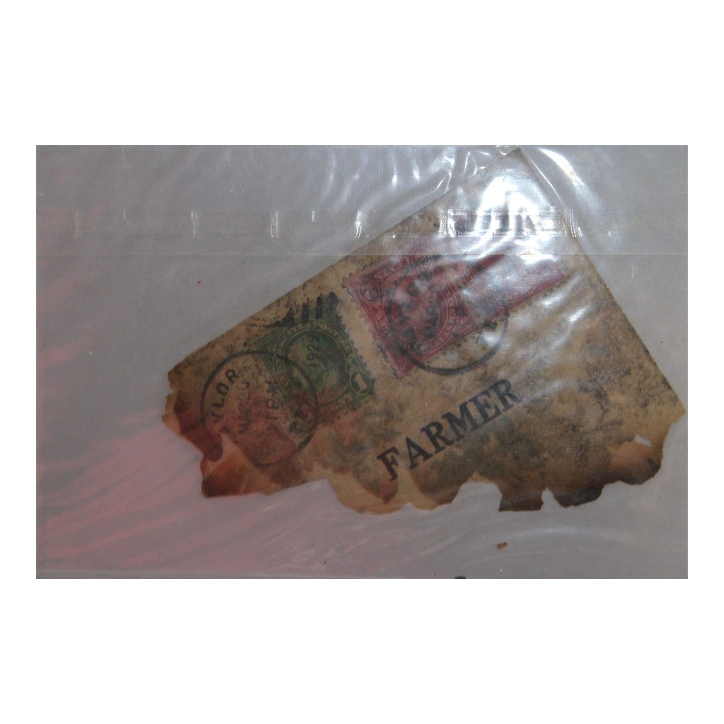 Vintage label with 'Farmer' text under a clear plastic cover