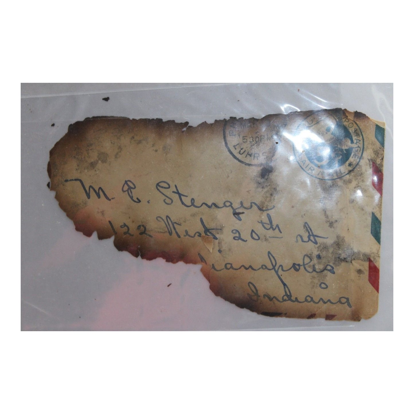 Vintage letter with handwritten address and stamps on a clear background