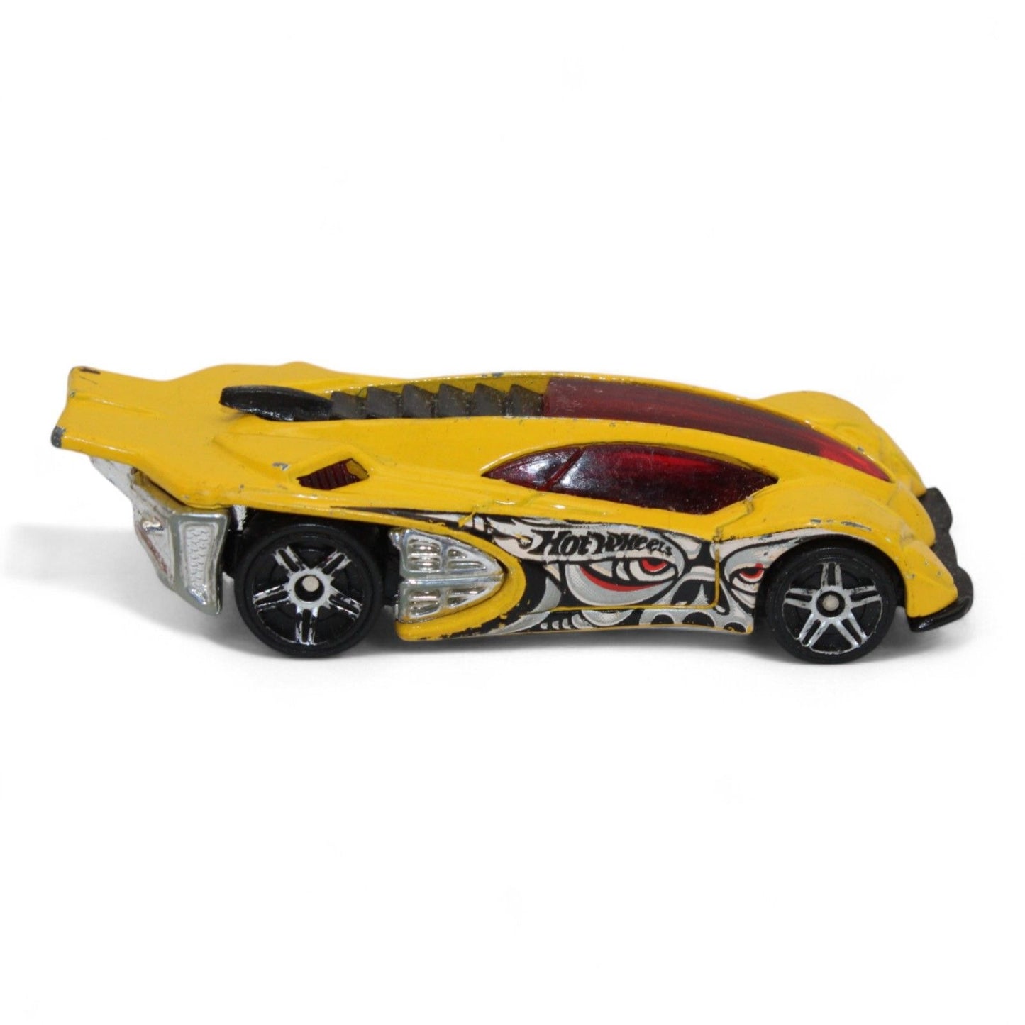 The 2004 Hot Wheels Yellow Side Draft Cyborg Assault is an ultra-rare die-cast toy car with sleek lines and exclusive graphic detailing.