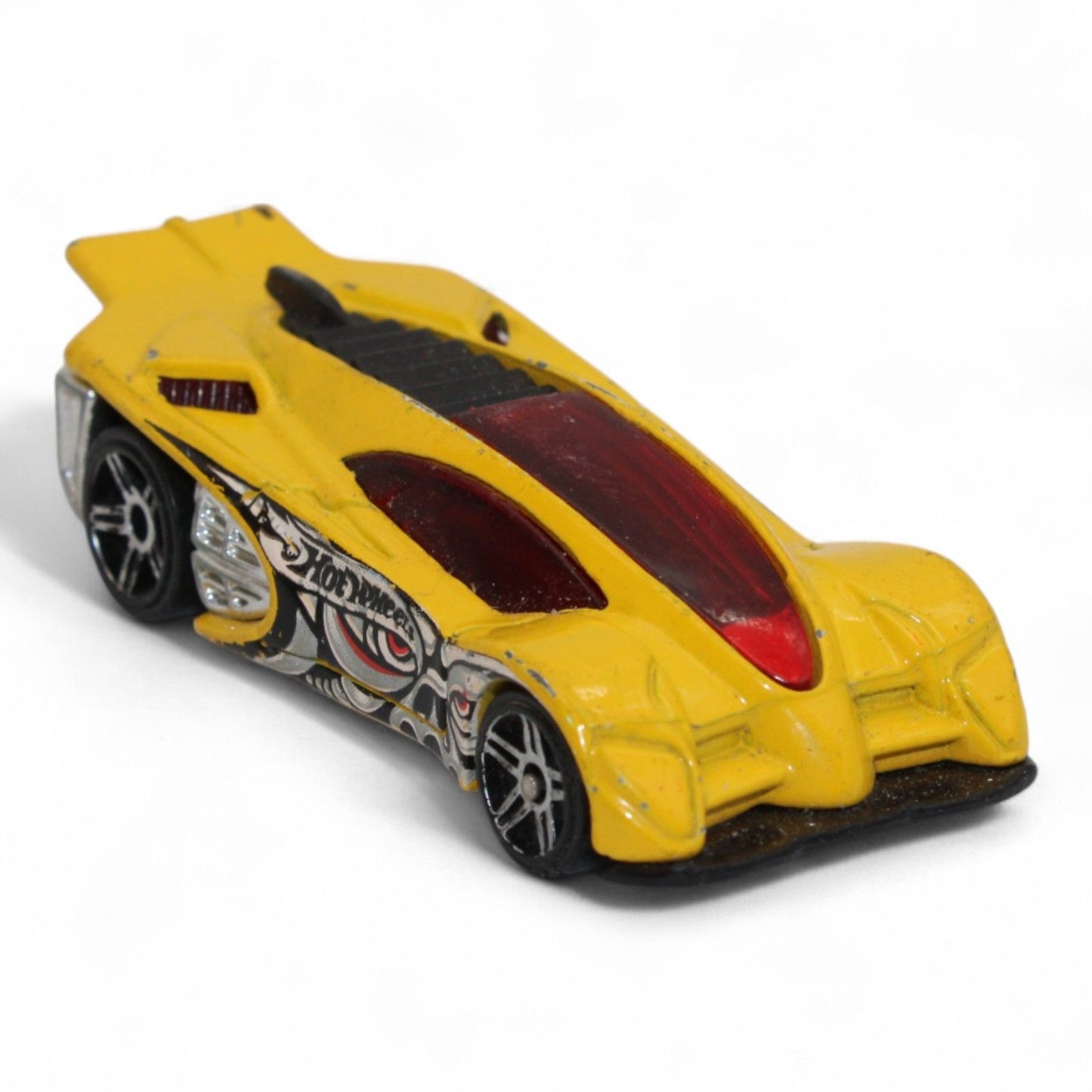 The 2004 Hot Wheels Yellow Side Draft Cyborg Assault is an ultra-rare die-cast toy car with sleek lines and exclusive graphic detailing.