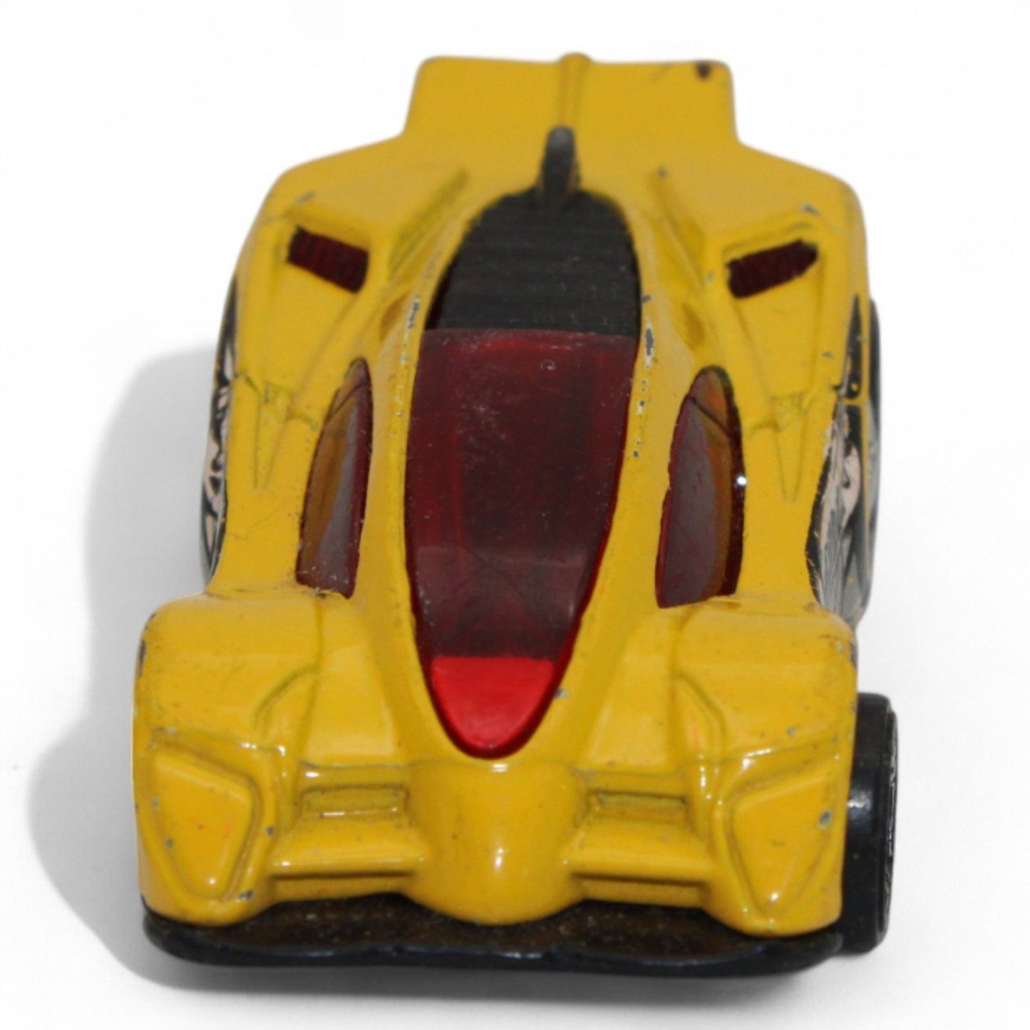 The 2004 Hot Wheels Yellow Side Draft Cyborg Assault is an ultra-rare die-cast toy car with sleek lines and exclusive graphic detailing.