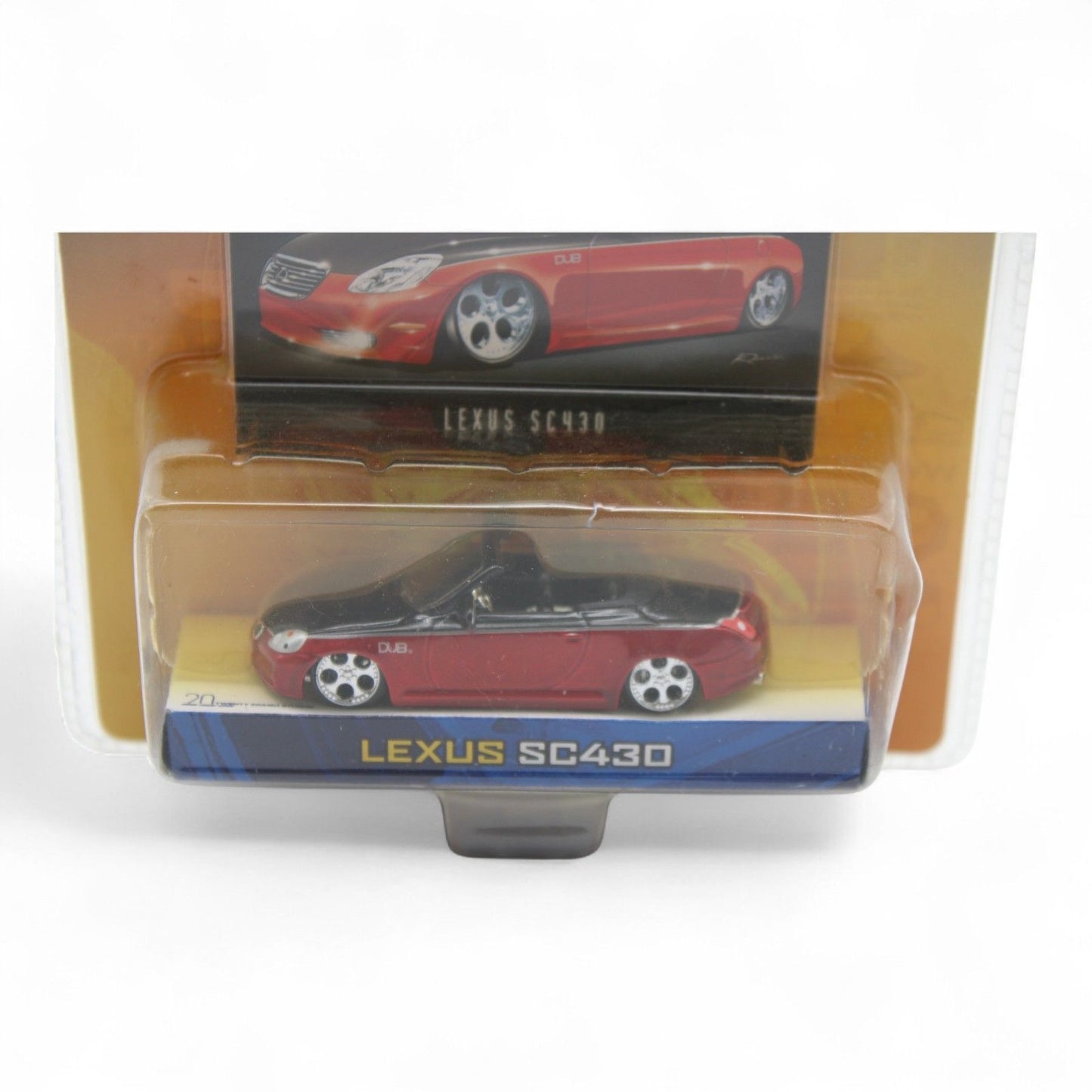 Jada Toys Dub City Lexus SC430 die-cast car in 1:64 scale features a sleek red and black finish, includes collectible trading card, new in package.