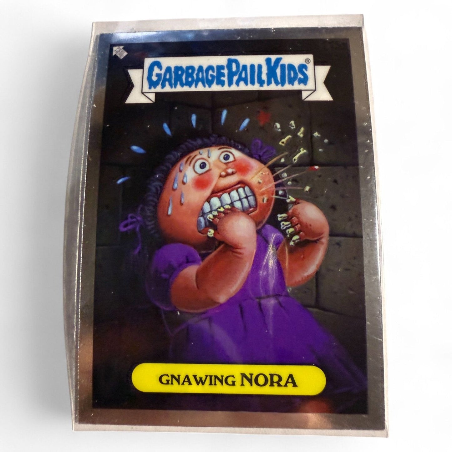 Garbage Pail Kids Trading Card #8 Gnawing Nora Featuring Elliot Mess