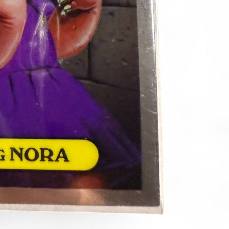 Garbage Pail Kids Trading Card #8 Gnawing Nora Featuring Elliot Mess