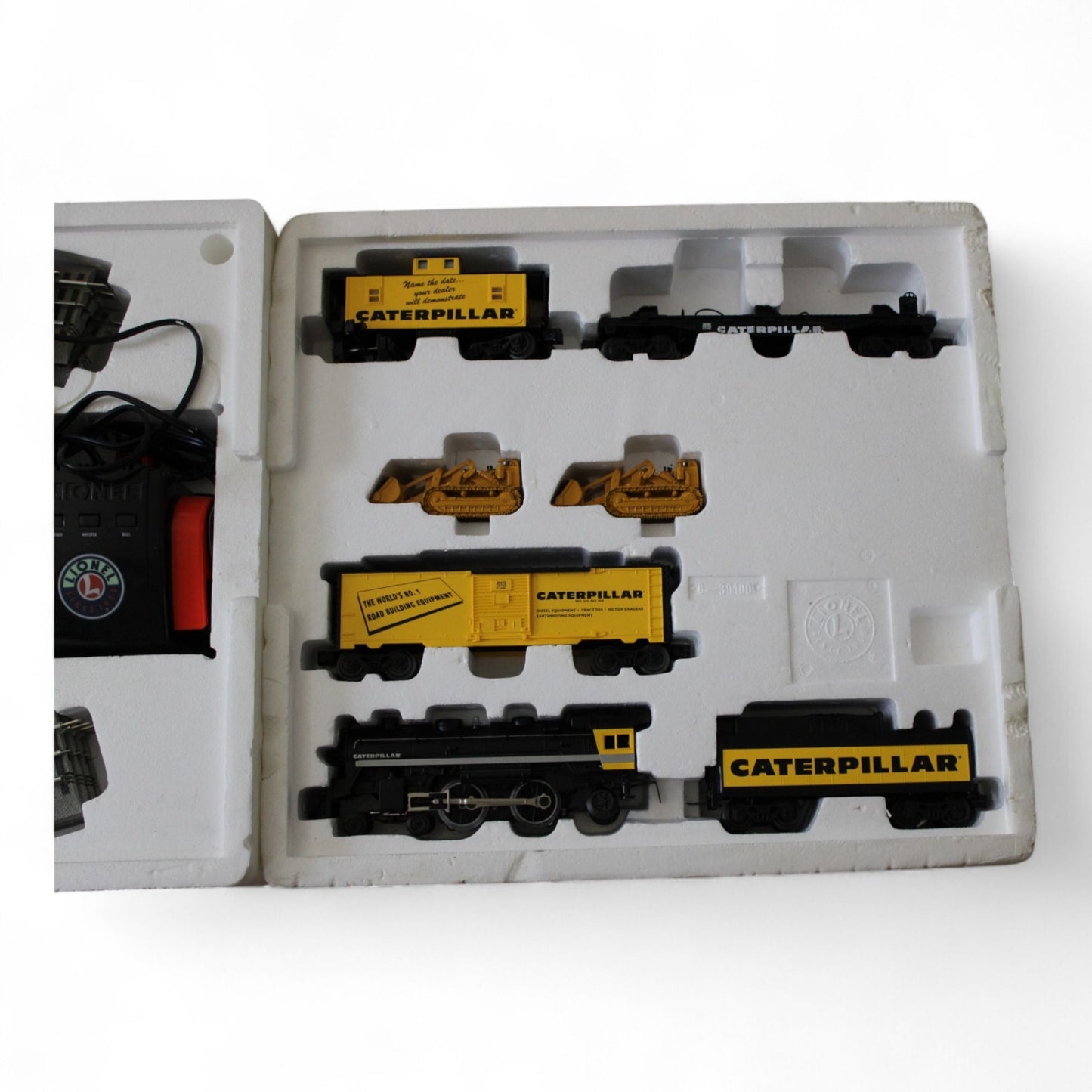 Lionel train set with steam engine and Caterpillar cars