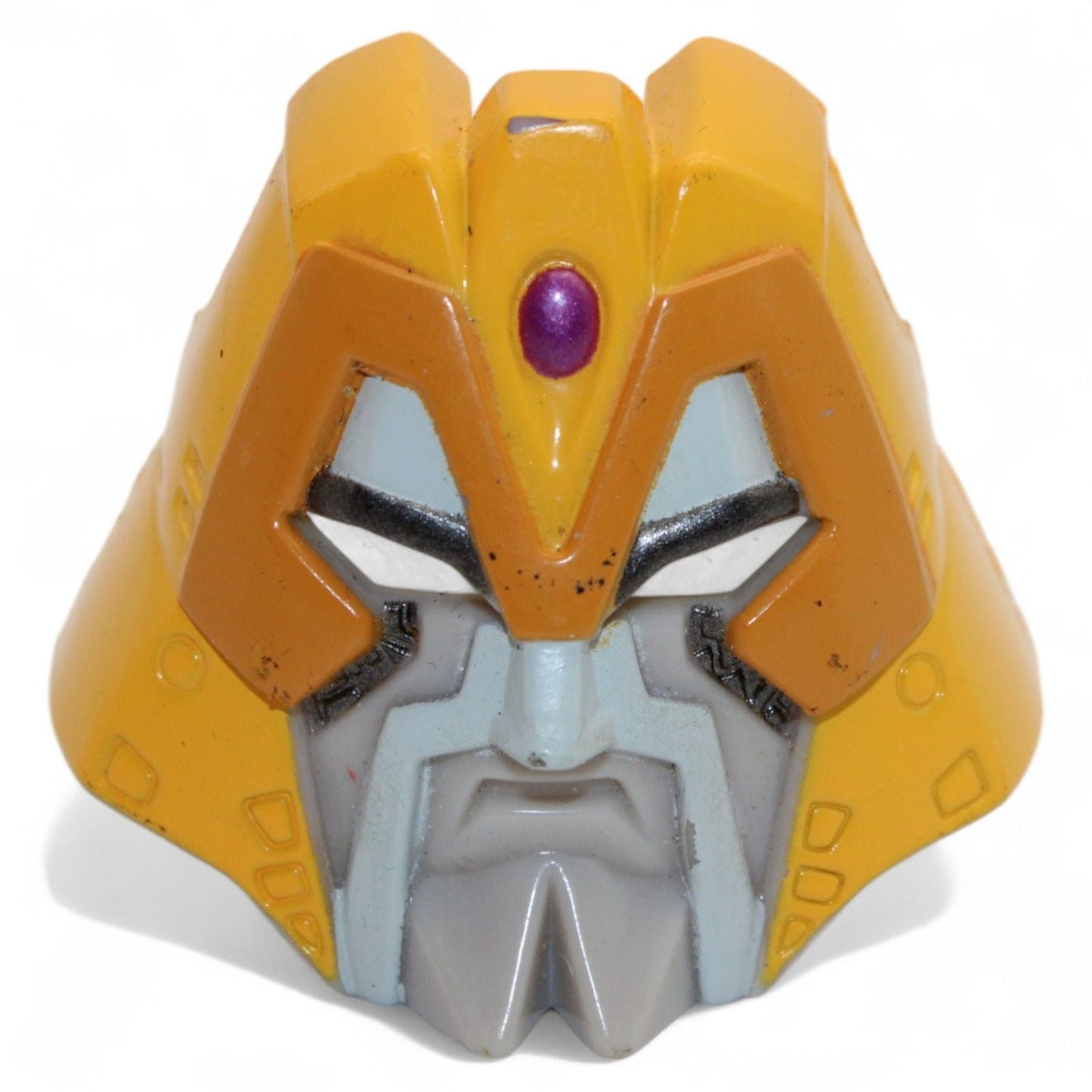 Front view of Transformers Armada Unicron face piece, collectible toy