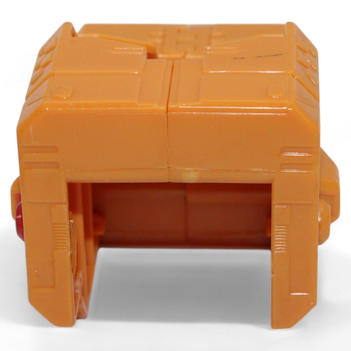 Side view of orange replacement part for Unicron figure