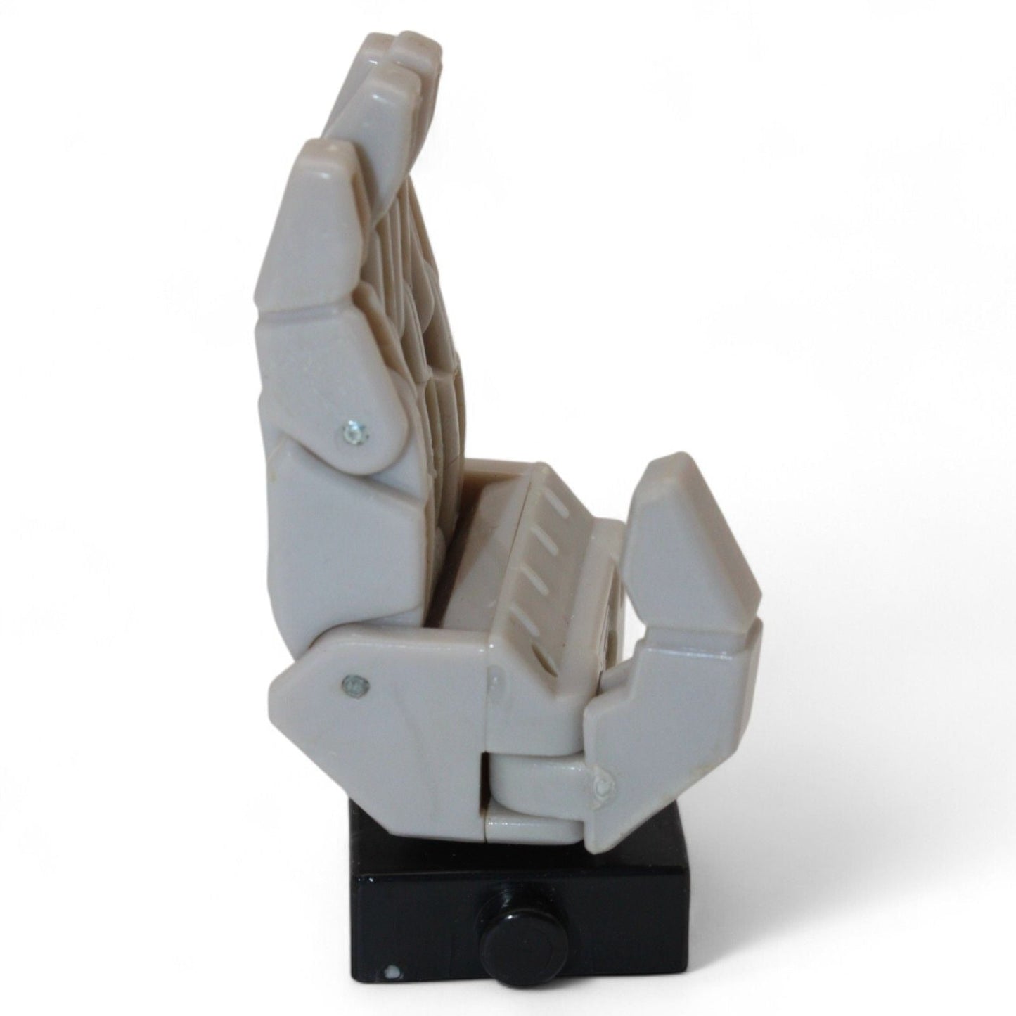 Side view of Transformers Armada Unicron left hand replacement part in gray and black