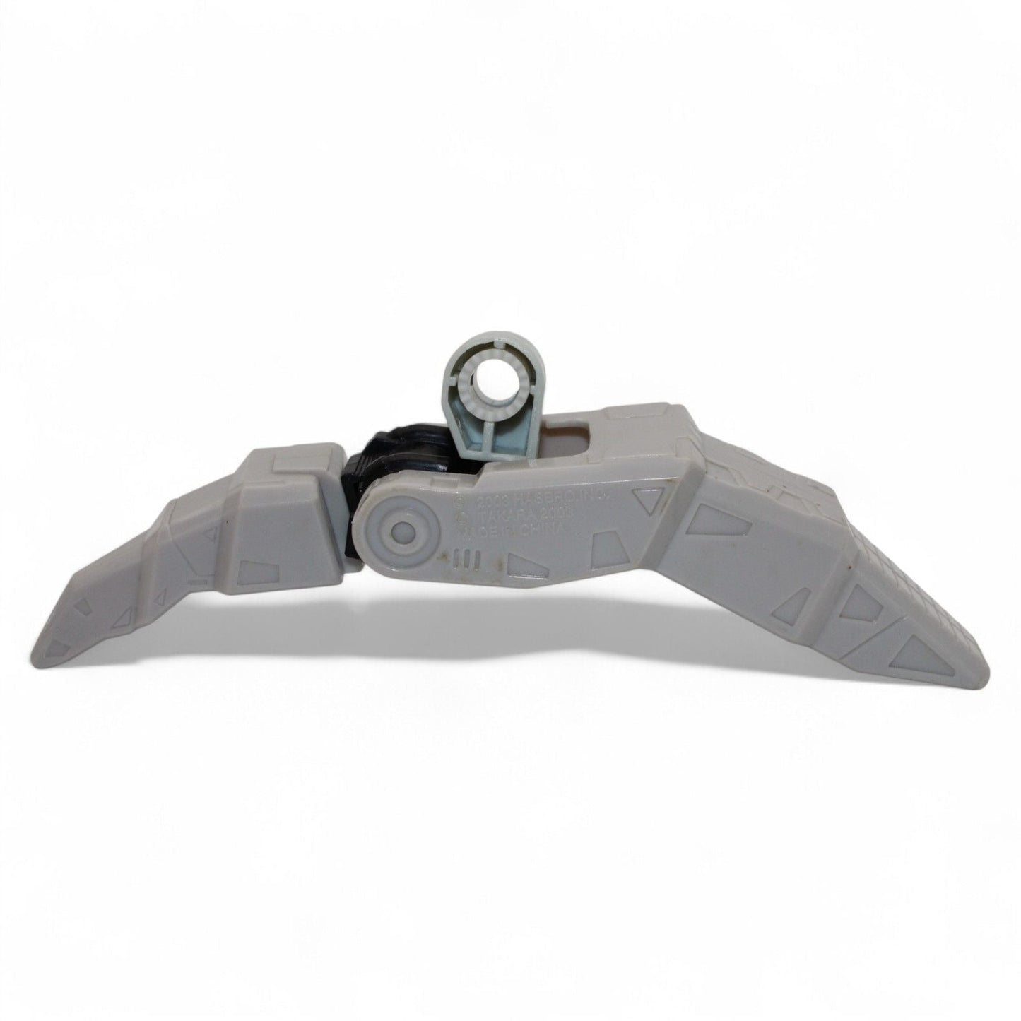 Gray plastic foot component for Transformers Armada Unicron, angled view