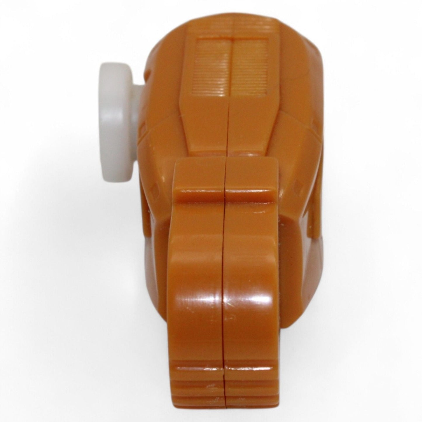 Close-up of the orange plastic Unicron Armada thigh replacement part
