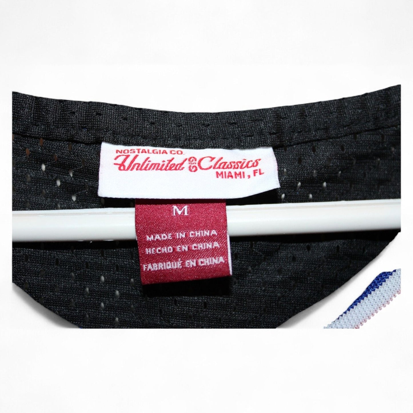 Close-up of the label on Tune Squad Lola #10 jersey showing size and brand
