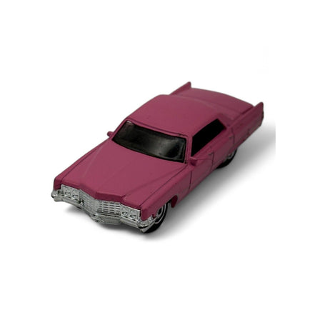 Side view of pink 1969 Cadillac Sedan DeVille diecast