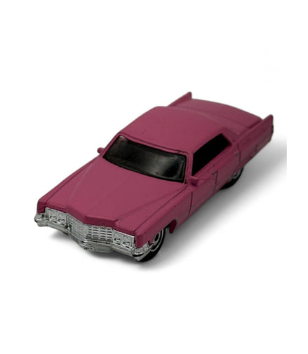 Side view of pink 1969 Cadillac Sedan DeVille diecast
