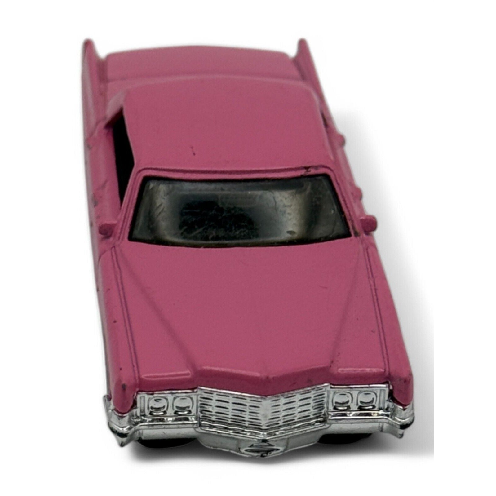Rear view of pink Cadillac Sedan DeVille diecast
