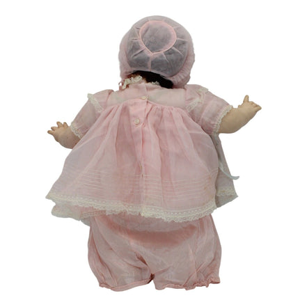 Back view of 1970s Madame Alexander Mary Mine Doll in pink dress and bonnet