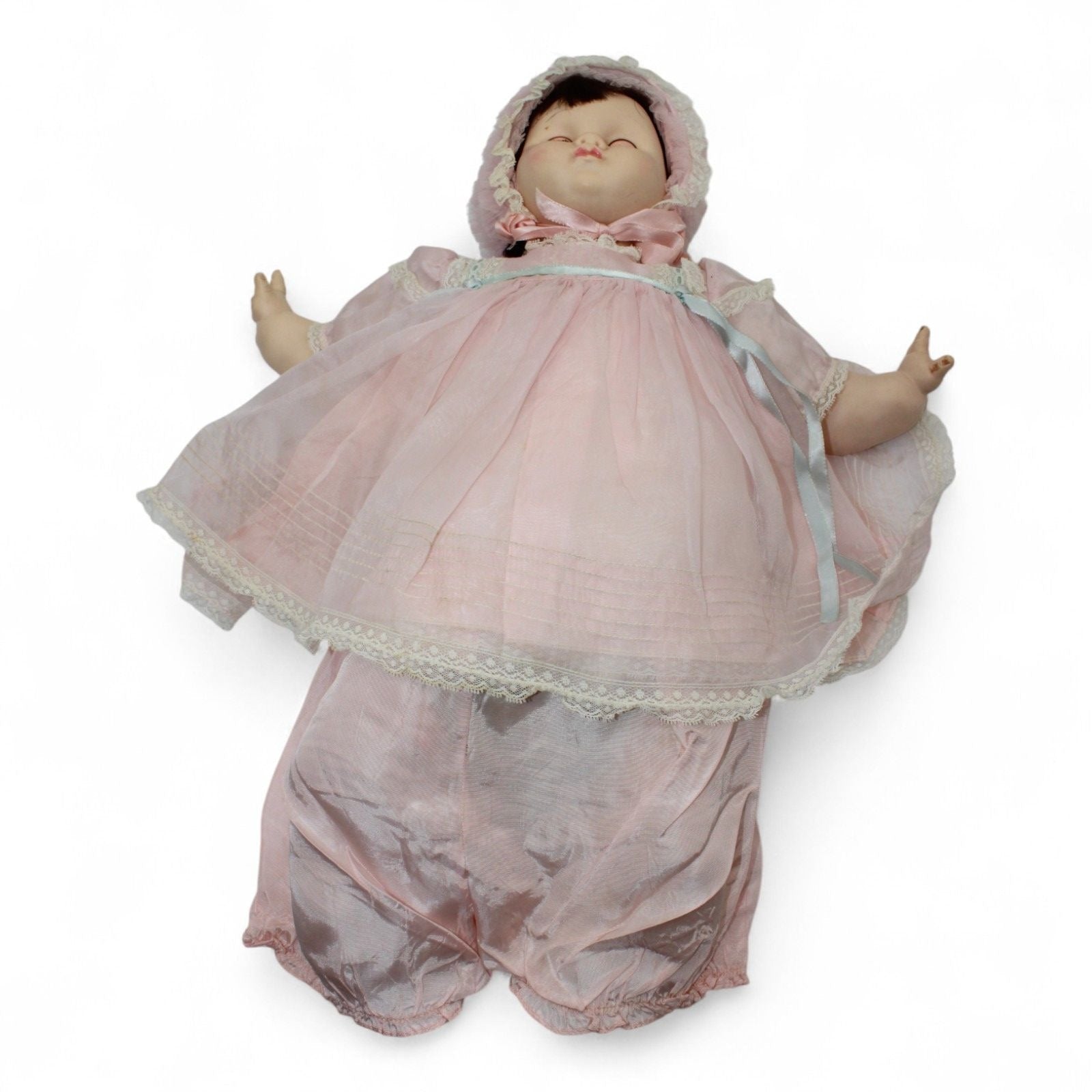 1970s Madame Alexander Mary Mine Doll lying down in pink outfit