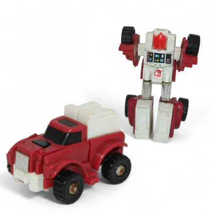 1984 Takara Transformers Swerve Mini Bot in robot and car form