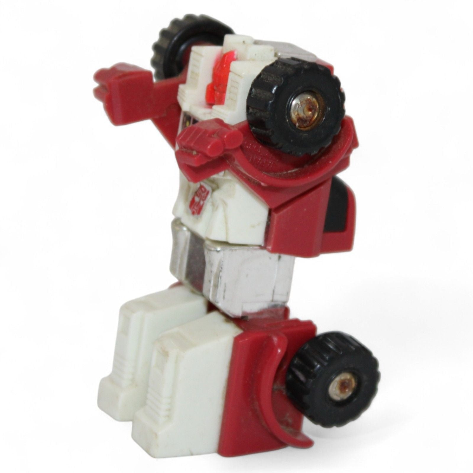 Side view of 1984 Takara Transformers Swerve Mini Bot robot
