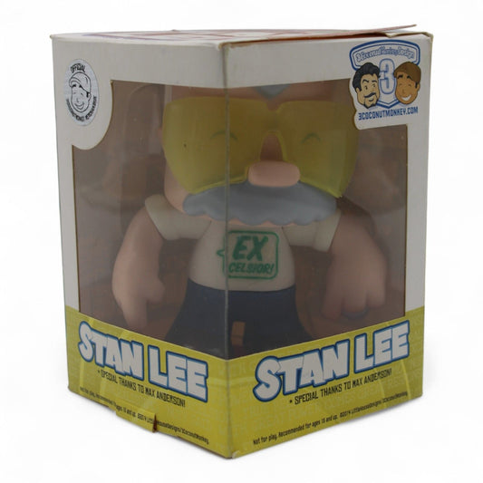 An officially licensed 2014 chibi-style Stan Lee vinyl figure by 3 Coconut Monkey, featuring Excelsior T-shirt and articulated design for display.

