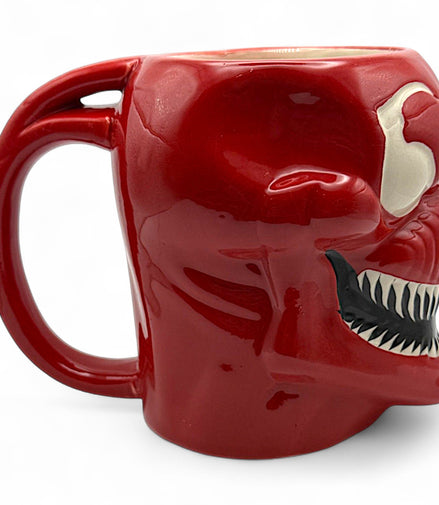 Side view of Carnage mug showing handle and sharp teeth detailing on red Marvel coffee mug
