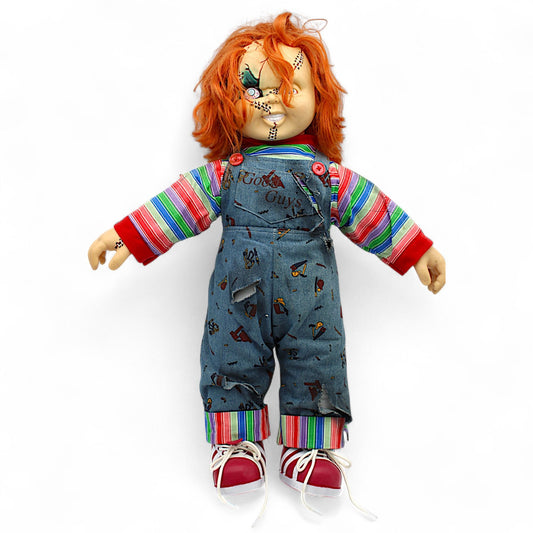 Front view of scarred Chucky Good Guys Doll collectible with stitched face and orange hair.

