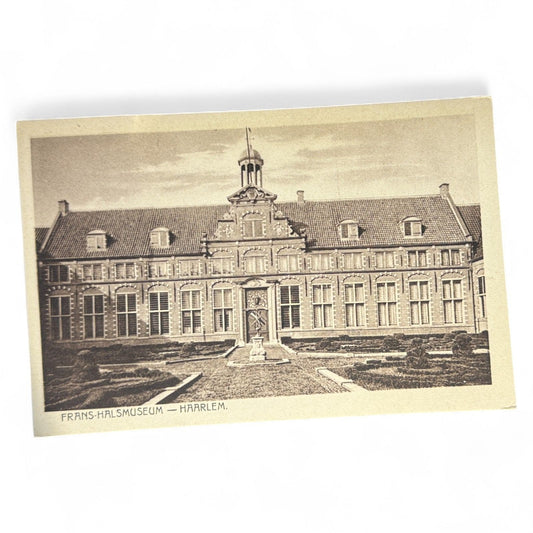 Vintage sepia postcard of the Frans Hals Museum in Haarlem, Netherlands, showing the stately facade and formal gardens, unused and well preserved.
