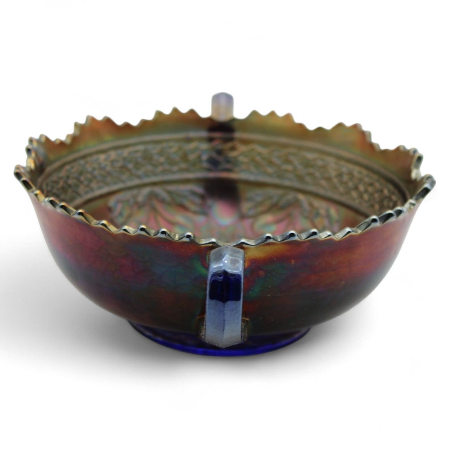 A vintage Fenton Carnival Glass cherry circles bonbon bowl with two handles, scalloped edge, and beautiful iridescent finish, excellent display piece.
