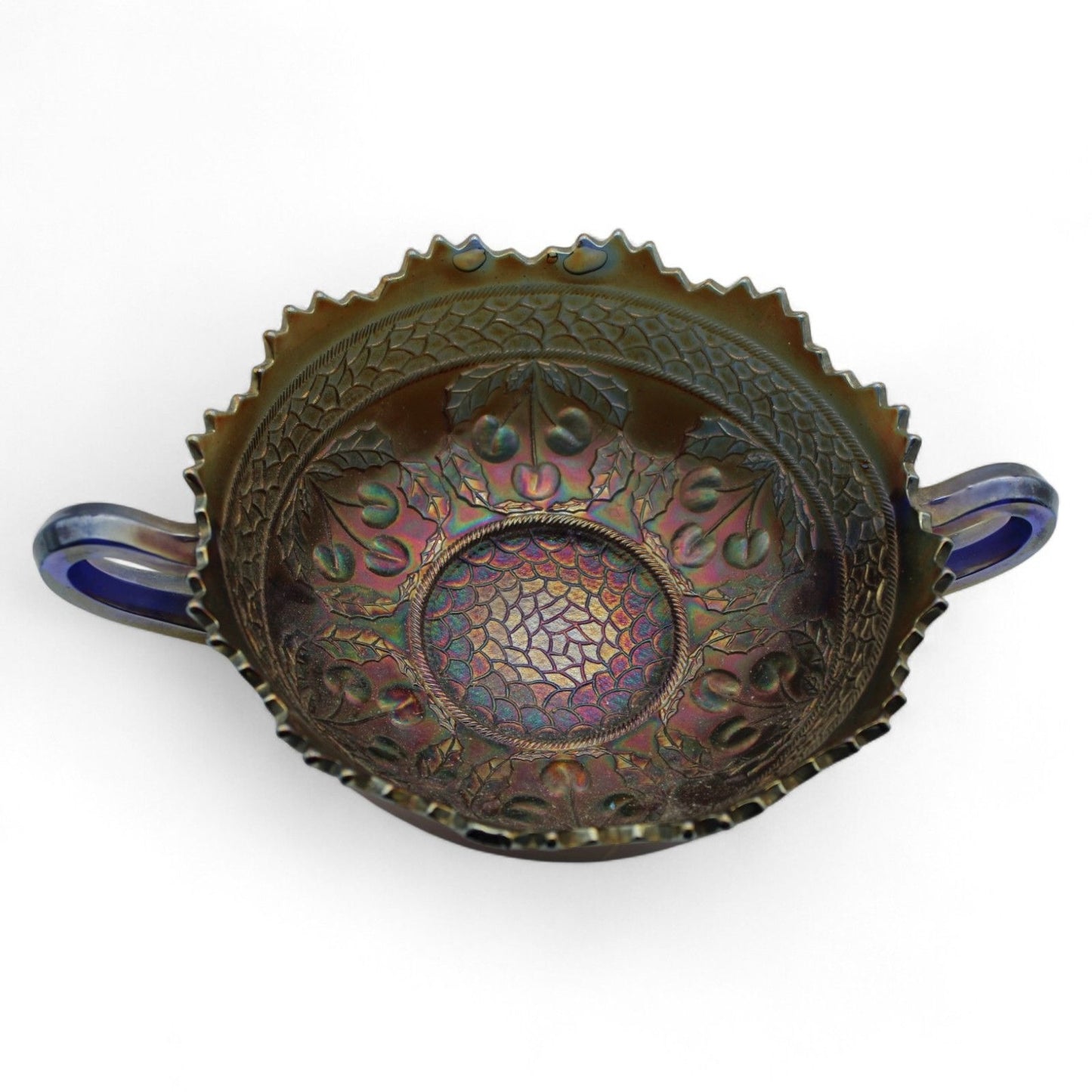 A vintage Fenton Carnival Glass cherry circles bonbon bowl with two handles, scalloped edge, and beautiful iridescent finish, excellent display piece.
