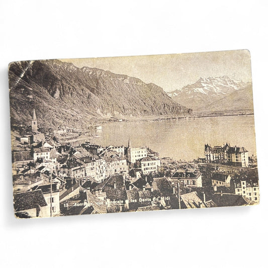 Vintage postcard of Vintage Montreux Postcard Les Dents Du Midi Switzerland and a mountainous town with a lake