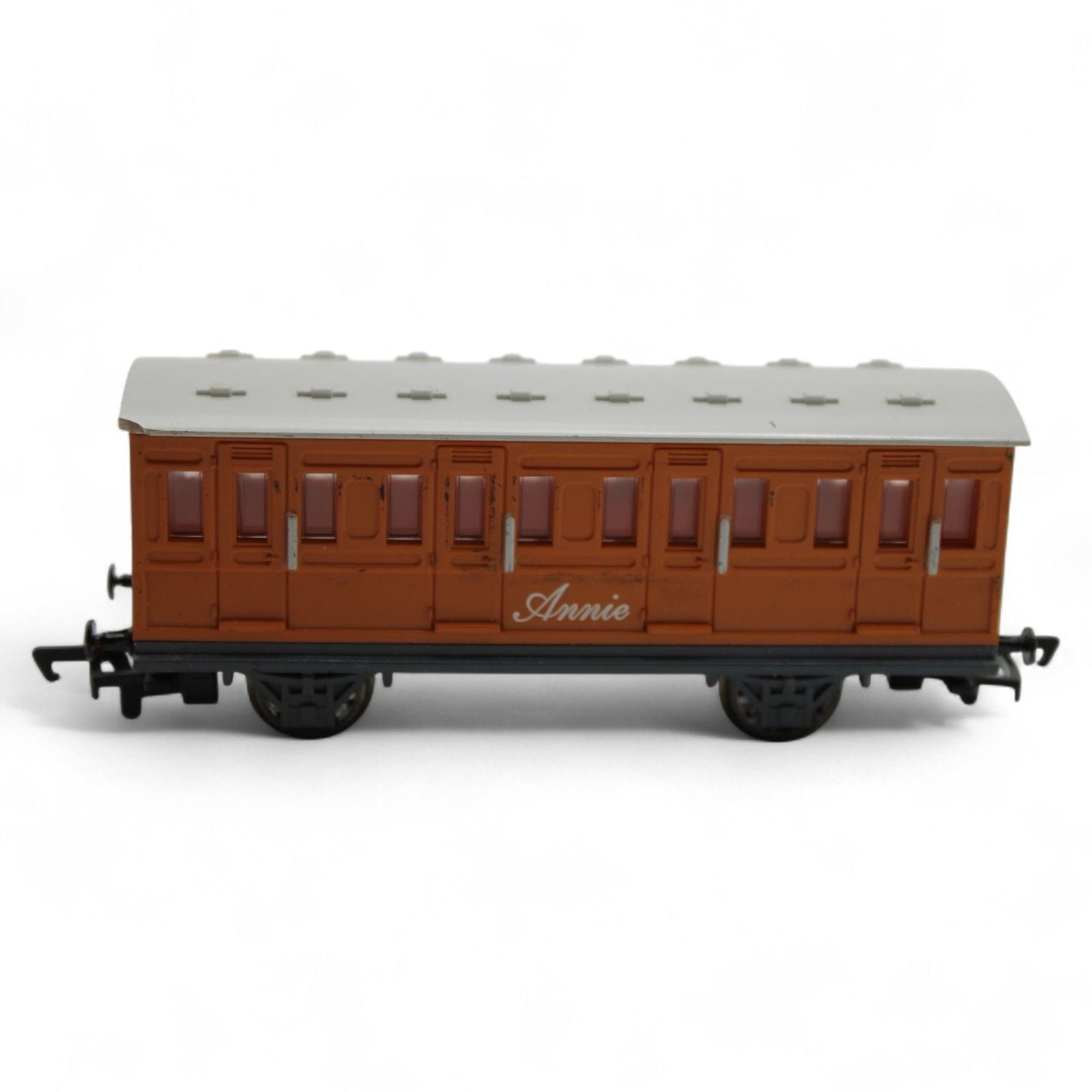 Annie passenger coach toy model in brown and gray plastic