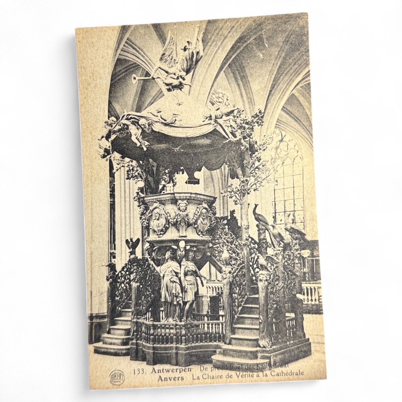 Vintage sepia postcard of the ornate pulpit in Antwerp Cathedral, Belgium, showing elaborate baroque sculpture and fine architectural detail.