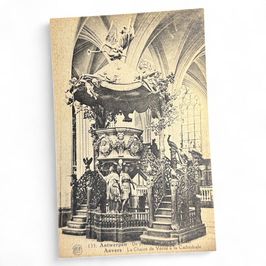 Vintage sepia postcard of the ornate pulpit in Antwerp Cathedral, Belgium, showing elaborate baroque sculpture and fine architectural detail.