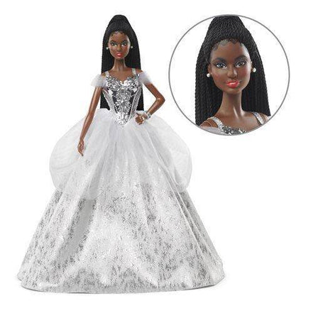 Close-up of Barbie 2021 Holiday Doll with dark hair and silver gown
