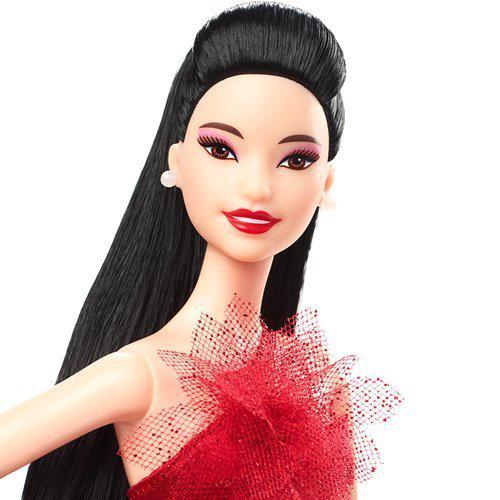 Barbie doll in red gown with long blonde hair