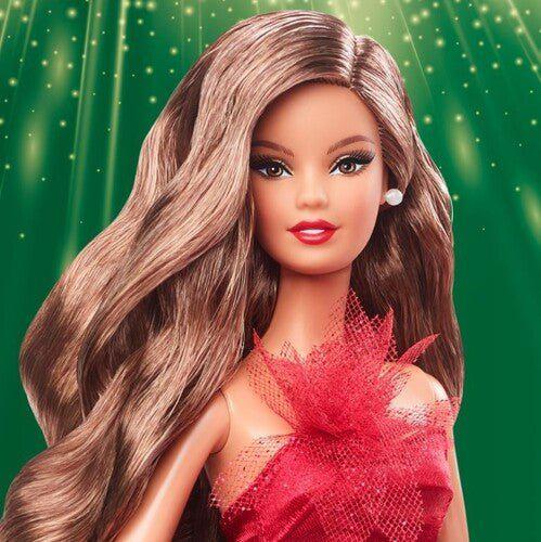 Close-up of Barbie doll with brown hair and red gown