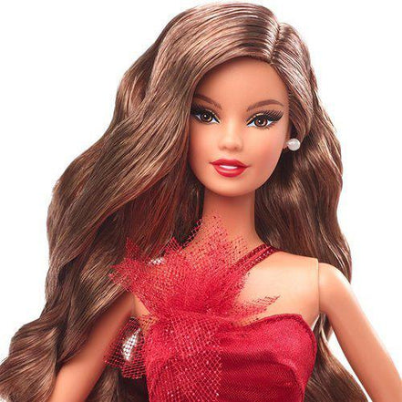 Close-up of Barbie doll with black hair and red gown