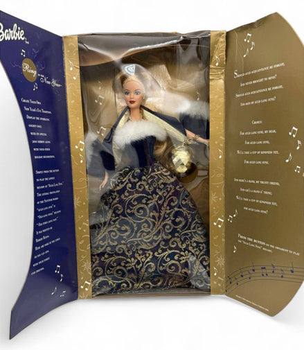 Barbie collector doll in gold and blue box with musical theme