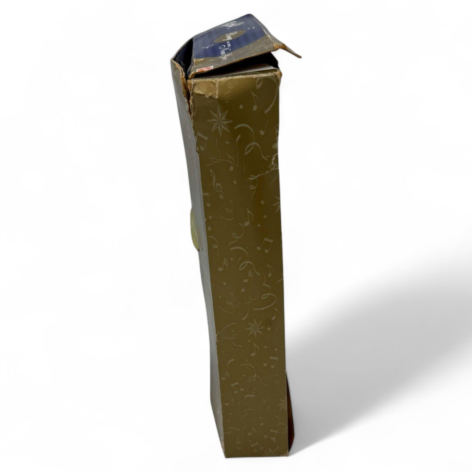 Side view of damaged gold and blue box for Barbie doll