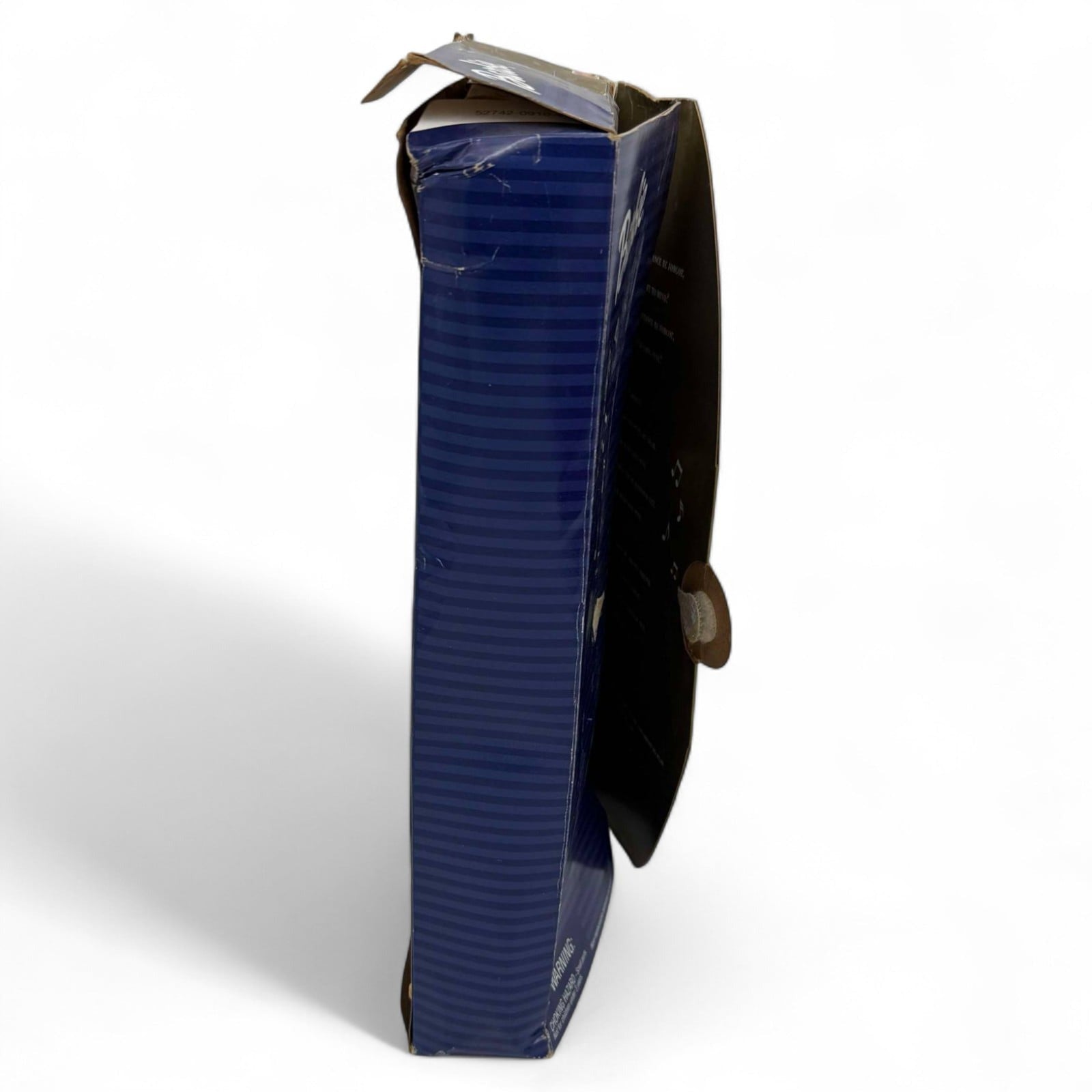 Side view showing wear on Barbie doll box