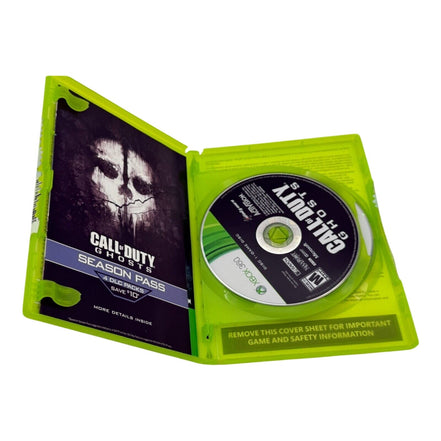 Open Call of Duty Ghosts Xbox 360 case showing disc and season pass