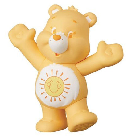 Yellow Care Bear figure with sun belly badge