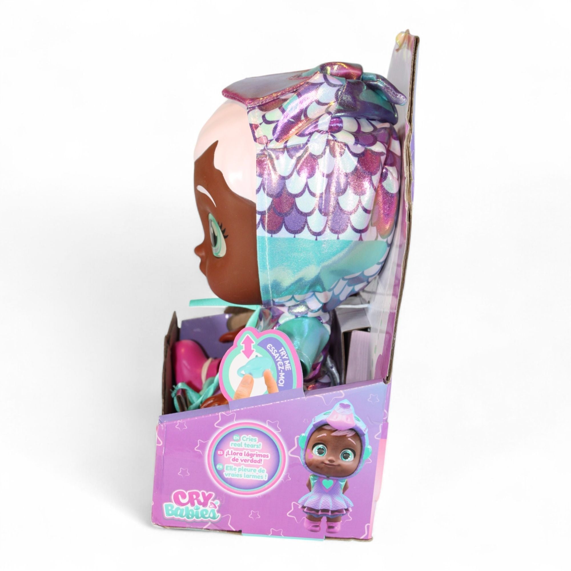 Side view of Cry Babies Ayla Doll showing bottle and star accessory