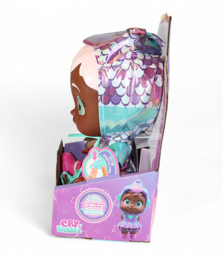 Side view of Cry Babies Ayla Doll showing bottle and star accessory