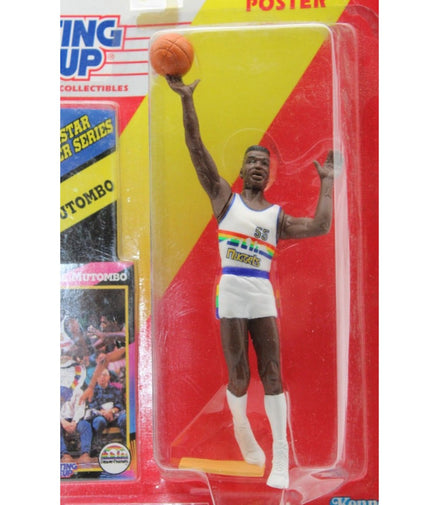 Close-up of Dikembe Mutombo action figure in Denver Nuggets uniform