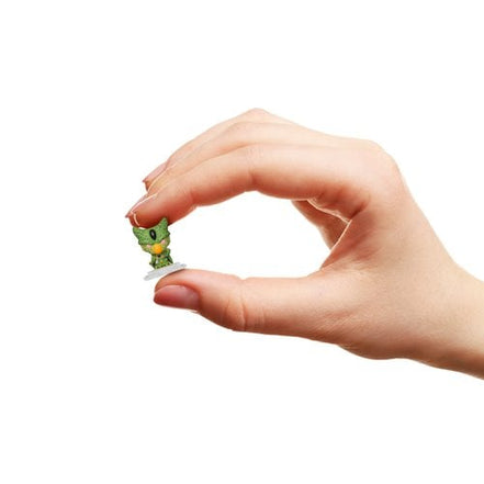 Hand holding a Funko Dragon Ball Z mini-figure of Cell