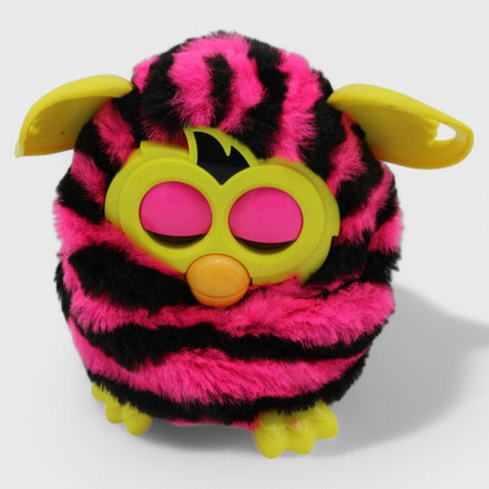 Furby Boom toy with pink and black stripes and yellow ears
